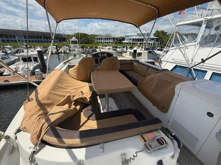 Wanderer Yacht Photos Pics 2016 Beneteau Swift Trawler 44 with spacious deck and seating at marina.