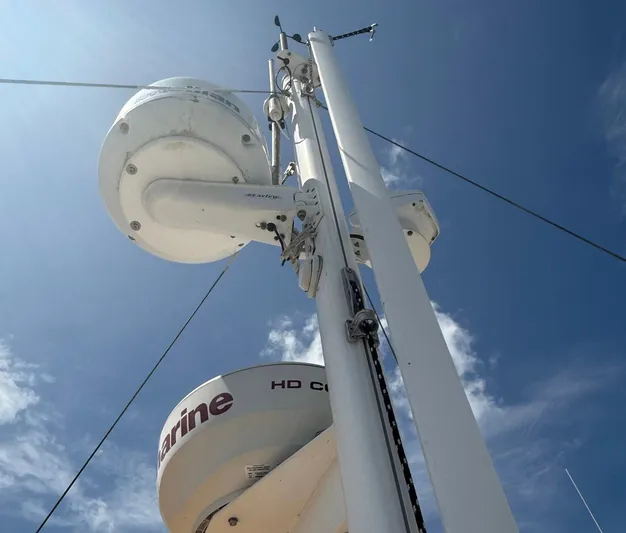 Wanderer Yacht Photos Pics Radar and communication equipment on a 2016 Beneteau Swift Trawler 44 against a clear blue sky.