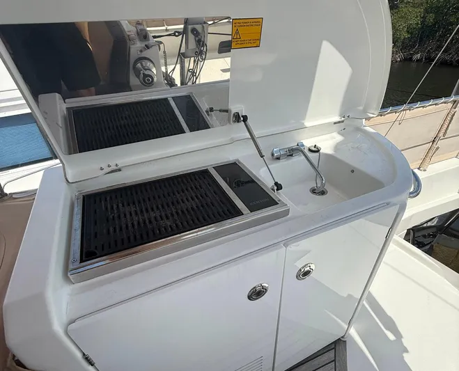Wanderer Yacht Photos Pics Outdoor kitchen on 2016 Beneteau Swift Trawler 44 with grill and sink.