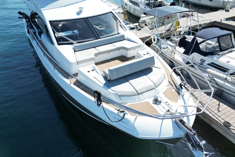  Yacht Photos Pics 2024 Azimut Fly 60 yacht docked, showcasing sleek design and spacious deck.