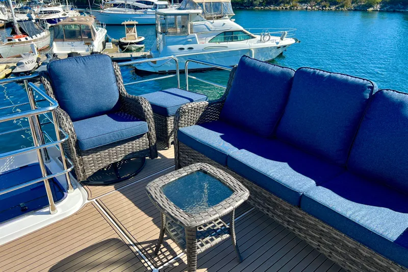  Yacht Photos Pics Luxurious seating on 2024 Azimut Fly 60 yacht, docked in a serene marina.