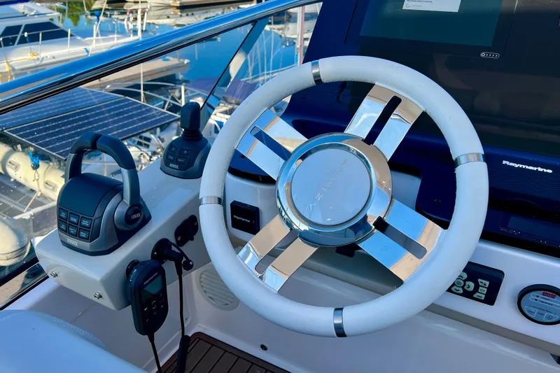  Yacht Photos Pics Steering wheel and controls of 2024 Azimut Fly 60 yacht at marina.