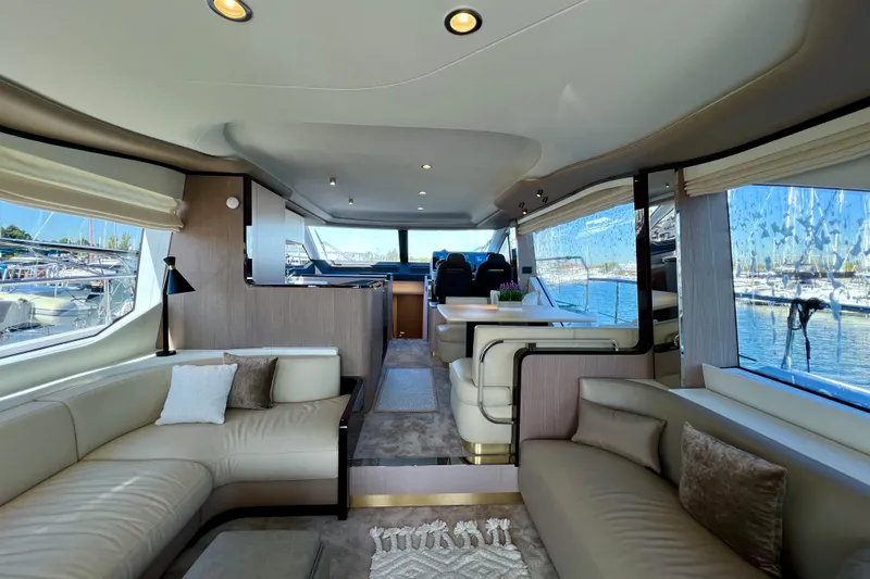  Yacht Photos Pics Luxurious interior of 2024 Azimut Fly 60 yacht with elegant seating and panoramic windows.