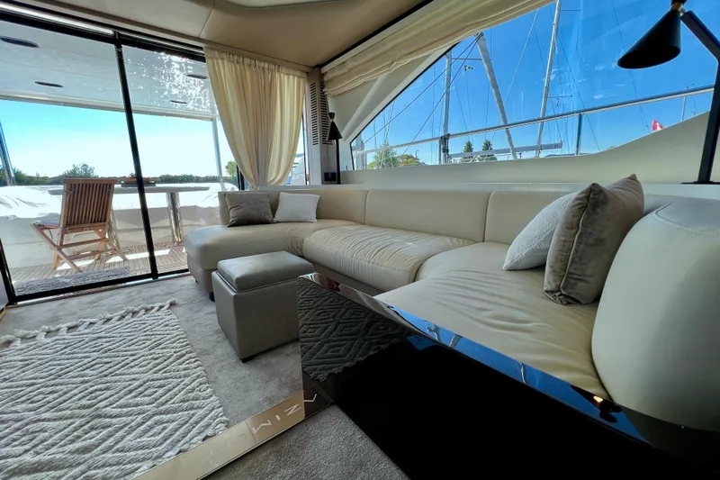  Yacht Photos Pics Luxurious interior of 2024 Azimut Fly 60 yacht with elegant seating and outdoor view.