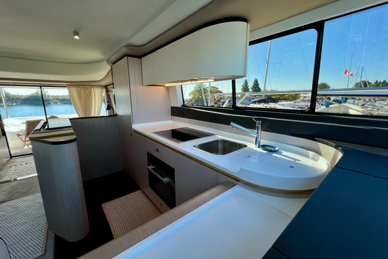  Yacht Photos Pics Luxurious interior of 2024 Azimut Fly 60 yacht with modern kitchen and scenic views.