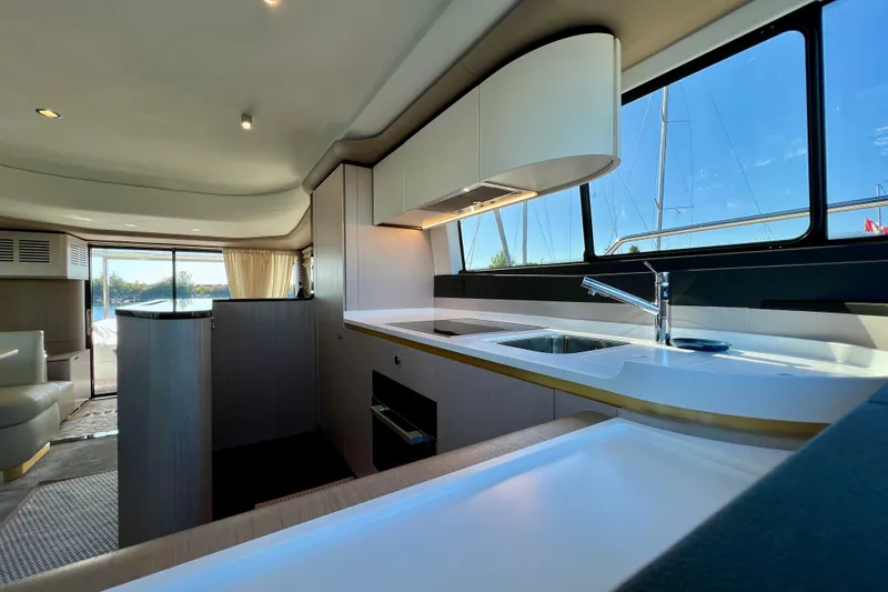  Yacht Photos Pics Luxurious interior of 2024 Azimut Fly 60 yacht with modern kitchen design.