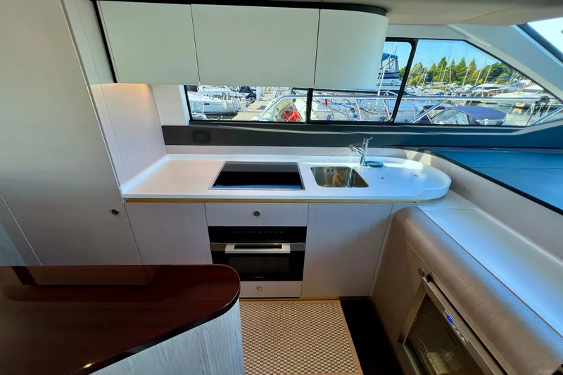  Yacht Photos Pics Luxurious kitchen interior of 2024 Azimut Fly 60 yacht with modern amenities.