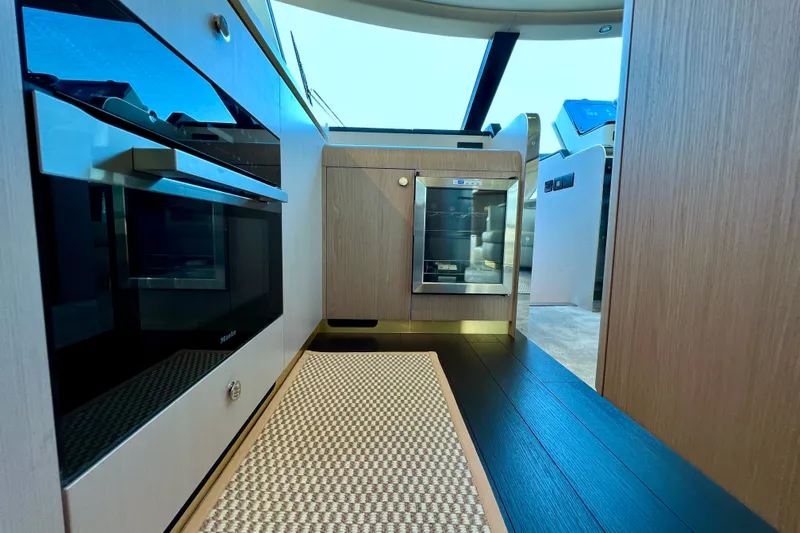  Yacht Photos Pics Luxurious interior of 2024 Azimut Fly 60 yacht kitchen with modern appliances.