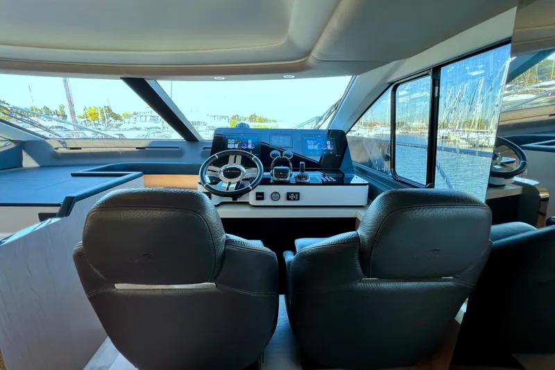  Yacht Photos Pics 2024 Azimut Fly 60 yacht cockpit with modern steering and navigation controls.