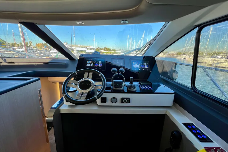  Yacht Photos Pics 2024 Azimut Fly 60 yacht cockpit with modern navigation controls and panoramic marina view.