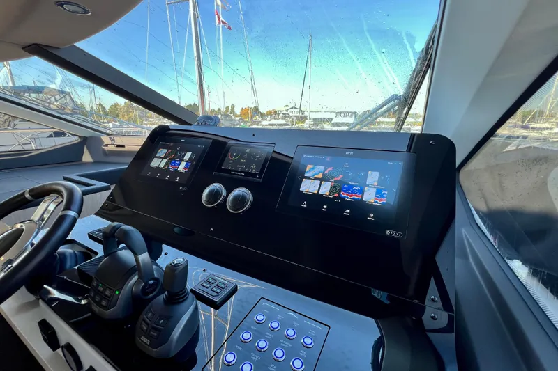  Yacht Photos Pics 2024 Azimut Fly 60 yacht cockpit with advanced navigation displays and controls.