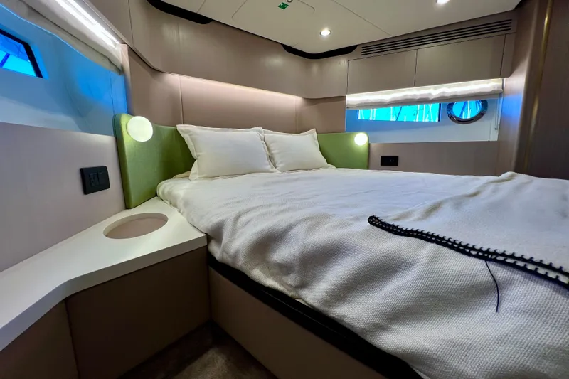  Yacht Photos Pics Luxurious bedroom interior of 2024 Azimut Fly 60 yacht with modern design.