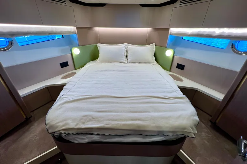  Yacht Photos Pics Luxurious bedroom interior of 2024 Azimut Fly 60 yacht with modern design.
