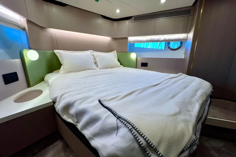  Yacht Photos Pics Luxurious bedroom interior of 2024 Azimut Fly 60 yacht with modern design.