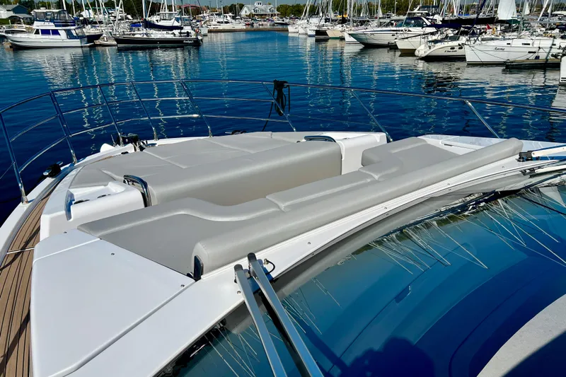  Yacht Photos Pics 2024 Azimut Fly 60 yacht with sleek deck design in a marina setting.