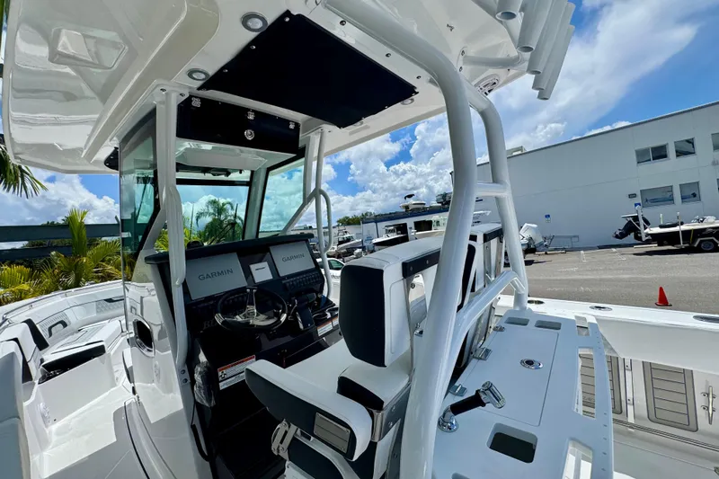  Yacht Photos Pics 2026 Blackfin 272 CC boat interior with Garmin navigation, sleek design, and modern controls.
