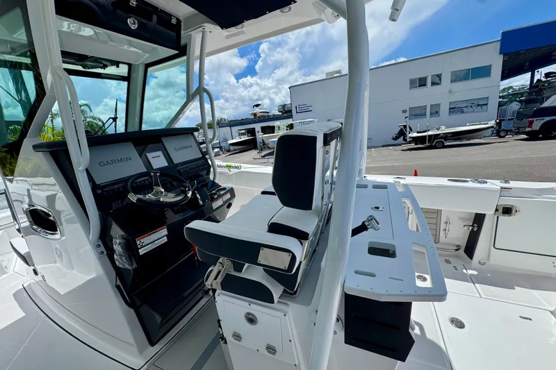  Yacht Photos Pics 2026 Blackfin 272 CC boat interior with Garmin navigation, sleek design, and modern controls.