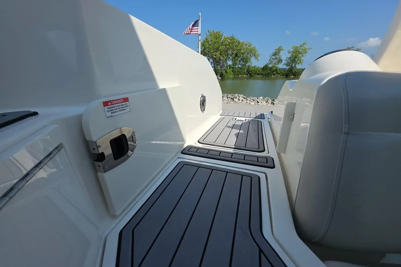  Yacht Photos Pics 2020 Sea Ray SLX 350 boat deck with seating, American flag, and scenic water view.