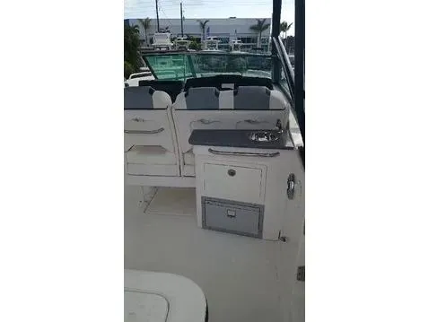 280-101 Yacht Photos Pics 2024 Chaparral 280 OSX boat interior with seating and kitchenette area.