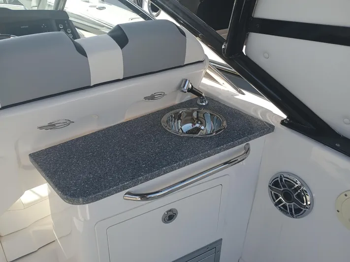 280-101 Yacht Photos Pics 2024 Chaparral 280 OSX boat interior with sink and countertop.