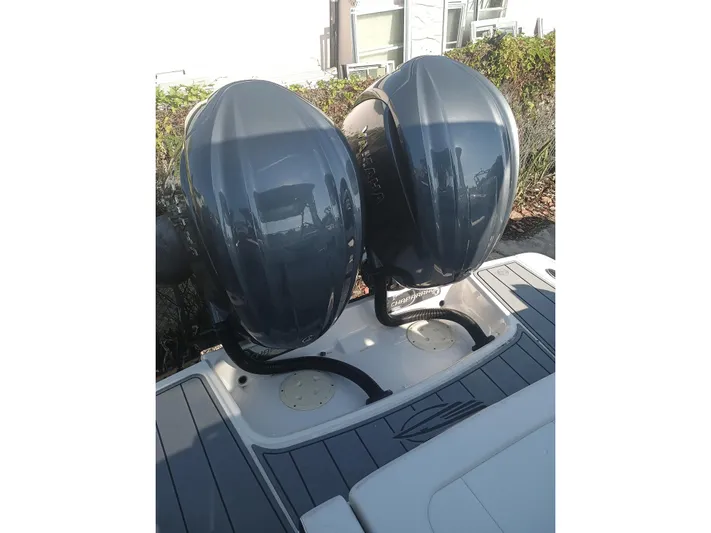 280-101 Yacht Photos Pics 2024 Chaparral 280 OSX boat with dual outboard engines, rear view.