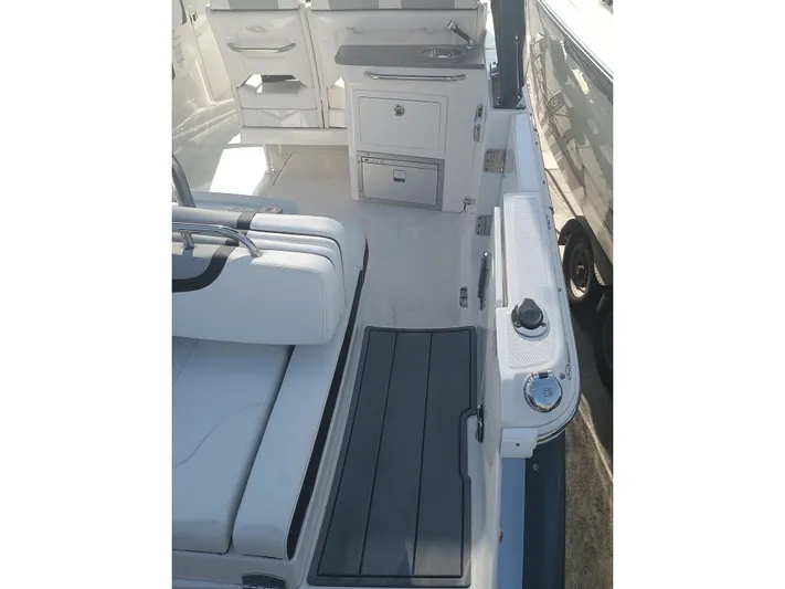 280-101 Yacht Photos Pics 2024 Chaparral 280 OSX boat interior with seating and storage compartments.