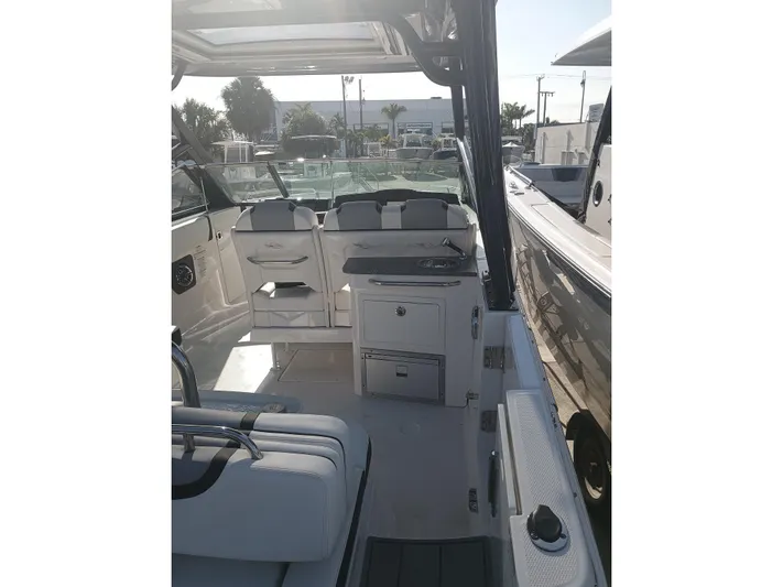 280-101 Yacht Photos Pics 2024 Chaparral 280 OSX boat interior with seating and storage compartments.