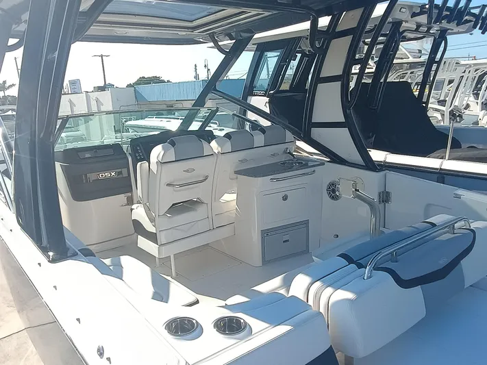 280-101 Yacht Photos Pics 2024 Chaparral 280 OSX boat interior with seating and helm station.