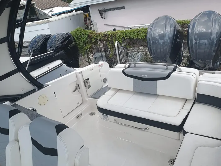 280-101 Yacht Photos Pics 2024 Chaparral 280 OSX boat interior with seating and dual outboard engines.