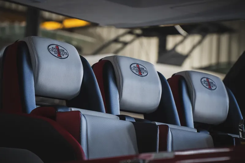  Yacht Photos Pics Luxury seating in 2025 Cigarette 41 Nighthawk boat, featuring branded headrests.