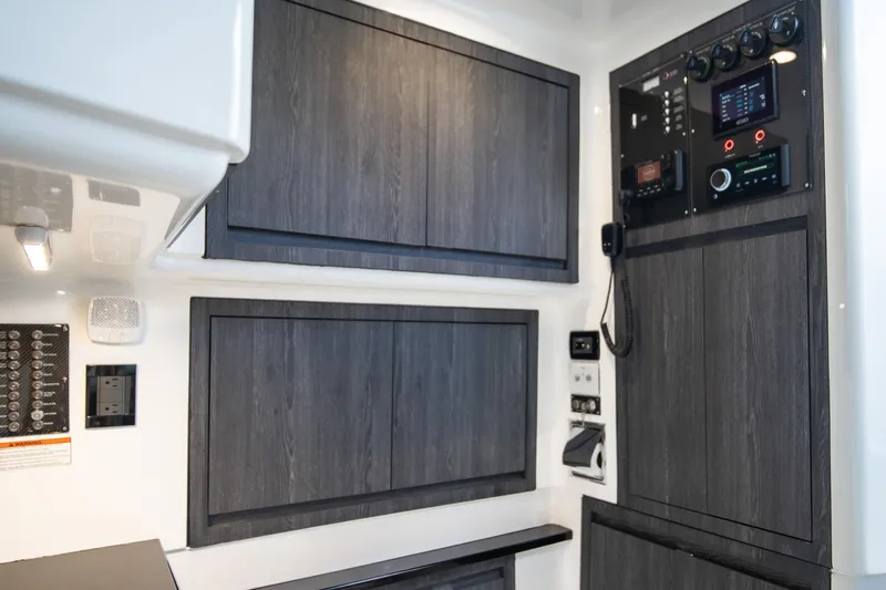  Yacht Photos Pics Interior of 2025 Cigarette 41 Nighthawk with modern control panels and cabinetry.