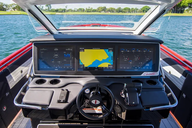  Yacht Photos Pics 2025 Cigarette 41 Nighthawk dashboard with advanced navigation screens on a lake.