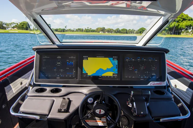  Yacht Photos Pics 2025 Cigarette 41 Nighthawk dashboard with advanced navigation screens on a lake.