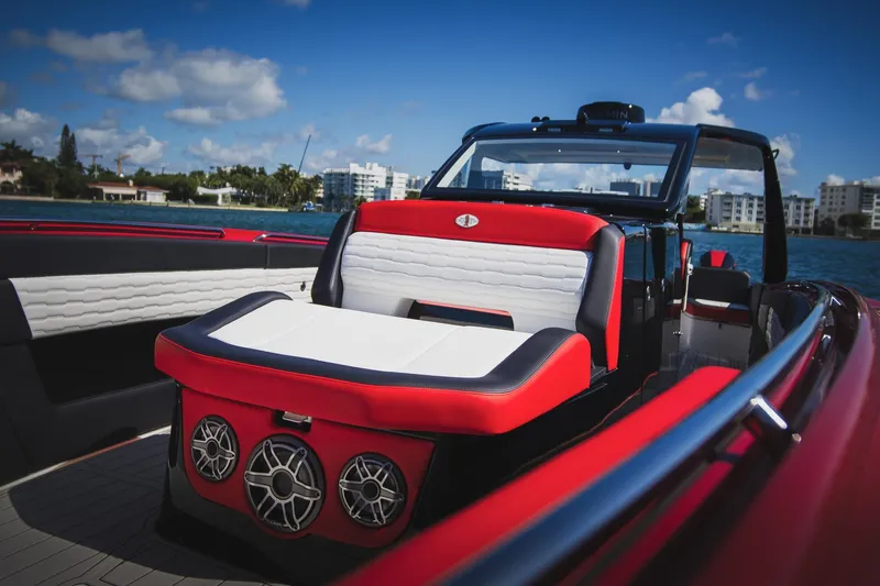  Yacht Photos Pics 2025 Cigarette 41 Nighthawk boat interior with red and white seating, on a sunny day.