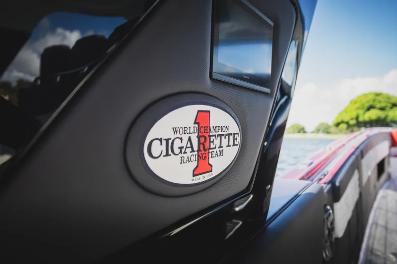  Yacht Photos Pics 2025 Cigarette 41 Nighthawk boat with racing team logo on display.