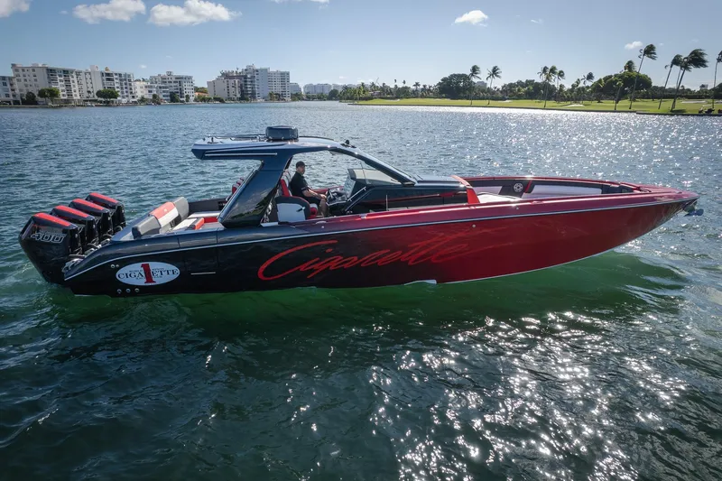  Yacht Photos Pics 2025 Cigarette 41 Nighthawk boat on water, sleek design, powerful engines, sunny day.