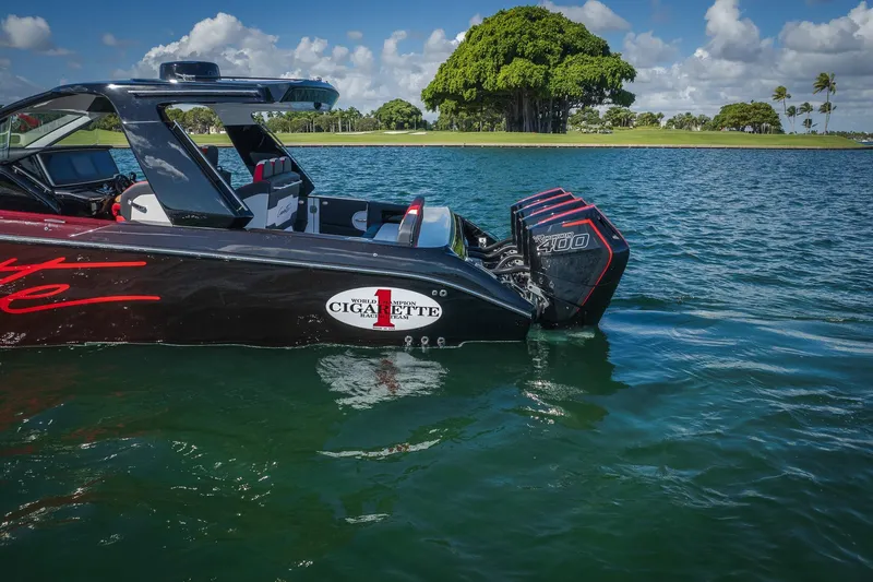 Yacht Photos Pics 2025 Cigarette 41 Nighthawk boat on water, featuring powerful engines and sleek design.