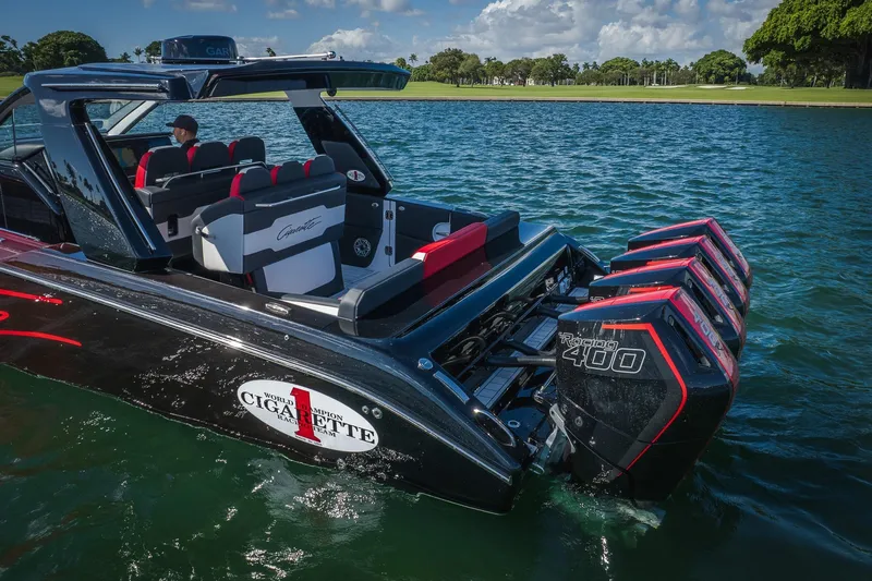  Yacht Photos Pics 2025 Cigarette 41 Nighthawk boat with powerful engines on a serene lake.