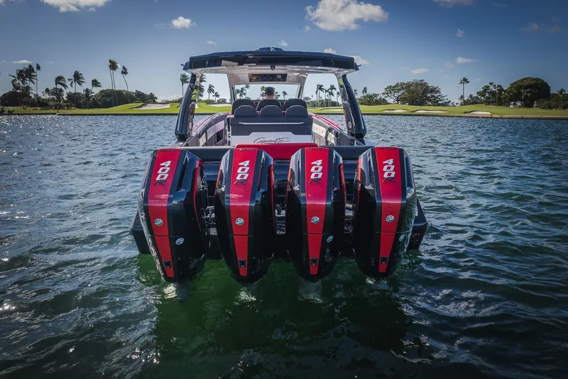  Yacht Photos Pics 2025 Cigarette 41 Nighthawk boat with four powerful outboard engines on water.