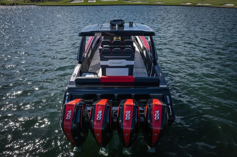  Yacht Photos Pics 2025 Cigarette 41 Nighthawk boat with four powerful engines on a sunny lake.