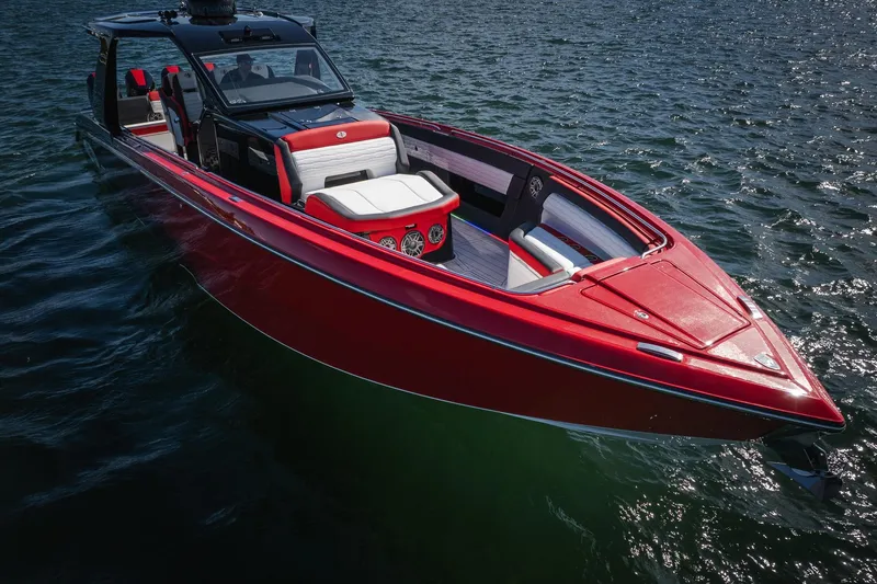 Yacht Photos Pics 2025 Cigarette 41 Nighthawk boat in vibrant red on open water.