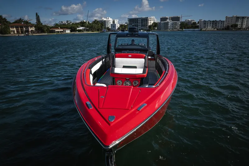  Yacht Photos Pics 2025 Cigarette 41 Nighthawk boat on water, vibrant red exterior, modern design.
