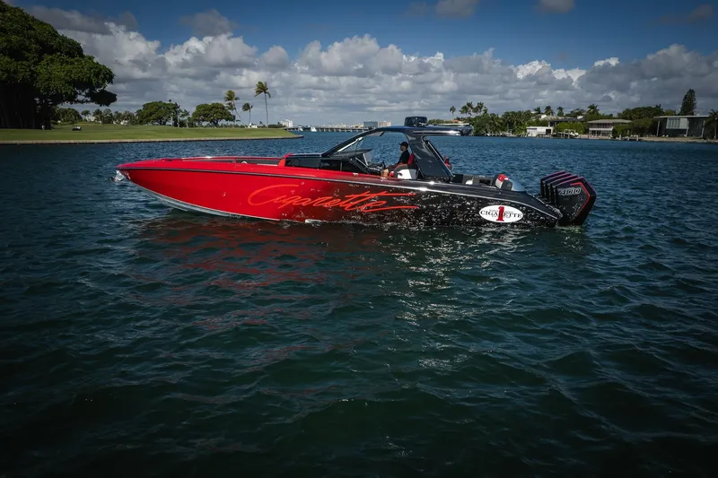  Yacht Photos Pics 2025 Cigarette 41 Nighthawk boat on water, vibrant red and black design.