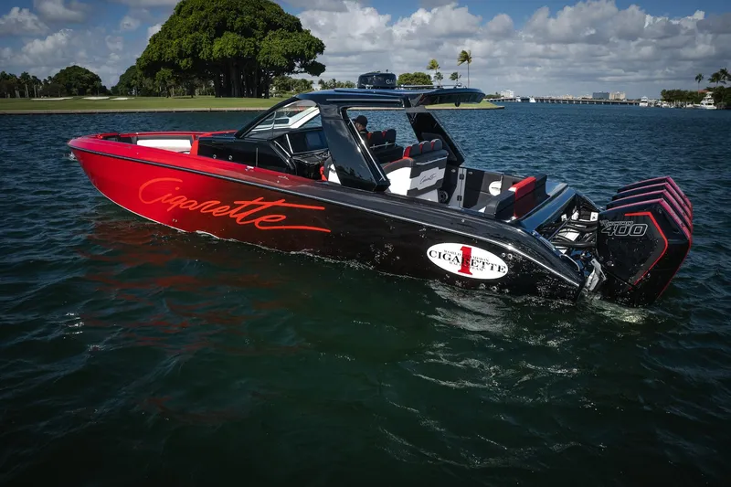  Yacht Photos Pics 2025 Cigarette 41 Nighthawk boat on water, featuring sleek design and powerful engines.