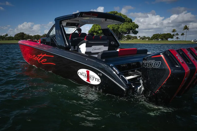  Yacht Photos Pics 2025 Cigarette 41 Nighthawk boat with powerful engines on a sunny day.