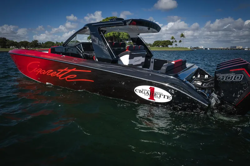 Yacht Photos Pics 2025 Cigarette 41 Nighthawk boat on water, featuring sleek design and powerful engines.