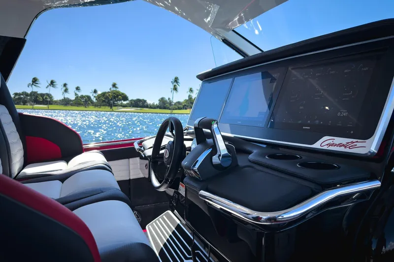  Yacht Photos Pics Interior of 2025 Cigarette 41 Nighthawk boat with modern dashboard and scenic water view.