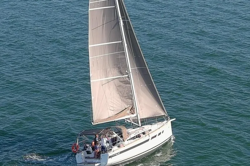 Prima Yacht Photos Pics 2024 Jeanneau Sun Odyssey 349 sailing on open water, showcasing sleek design and performance.