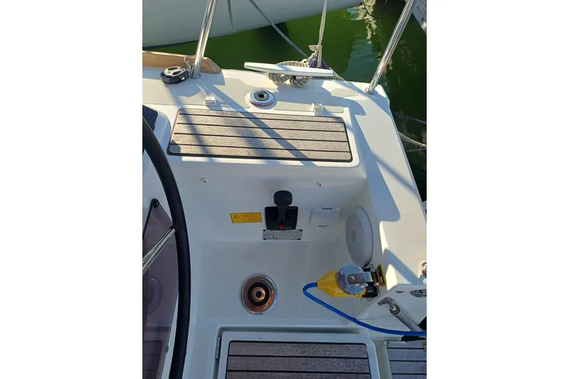 Prima Yacht Photos Pics Cockpit view of 2024 Jeanneau Sun Odyssey 349 sailboat, featuring steering wheel and deck details.