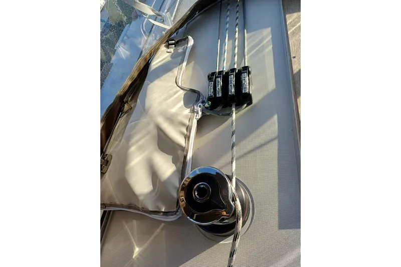 Prima Yacht Photos Pics Close-up of Jeanneau Sun Odyssey 349 sailboat deck, featuring winch and rope system, 2024 model.
